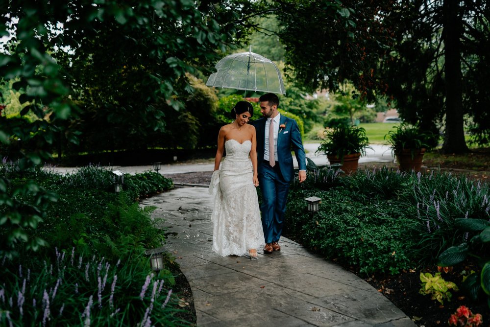 Lush Rainy Wedding at Knowlton Mansion in Philadelphia PA Moody Shadows and Umbrella Portraits