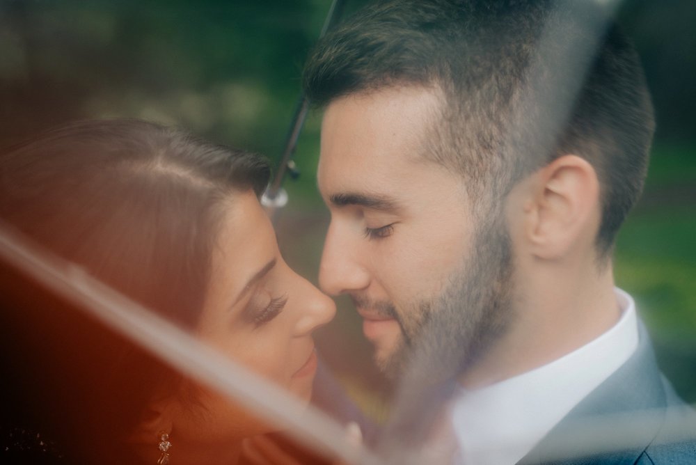 Lush Rainy Wedding at Knowlton Mansion in Philadelphia PA Moody Shadows and Umbrella Portraits