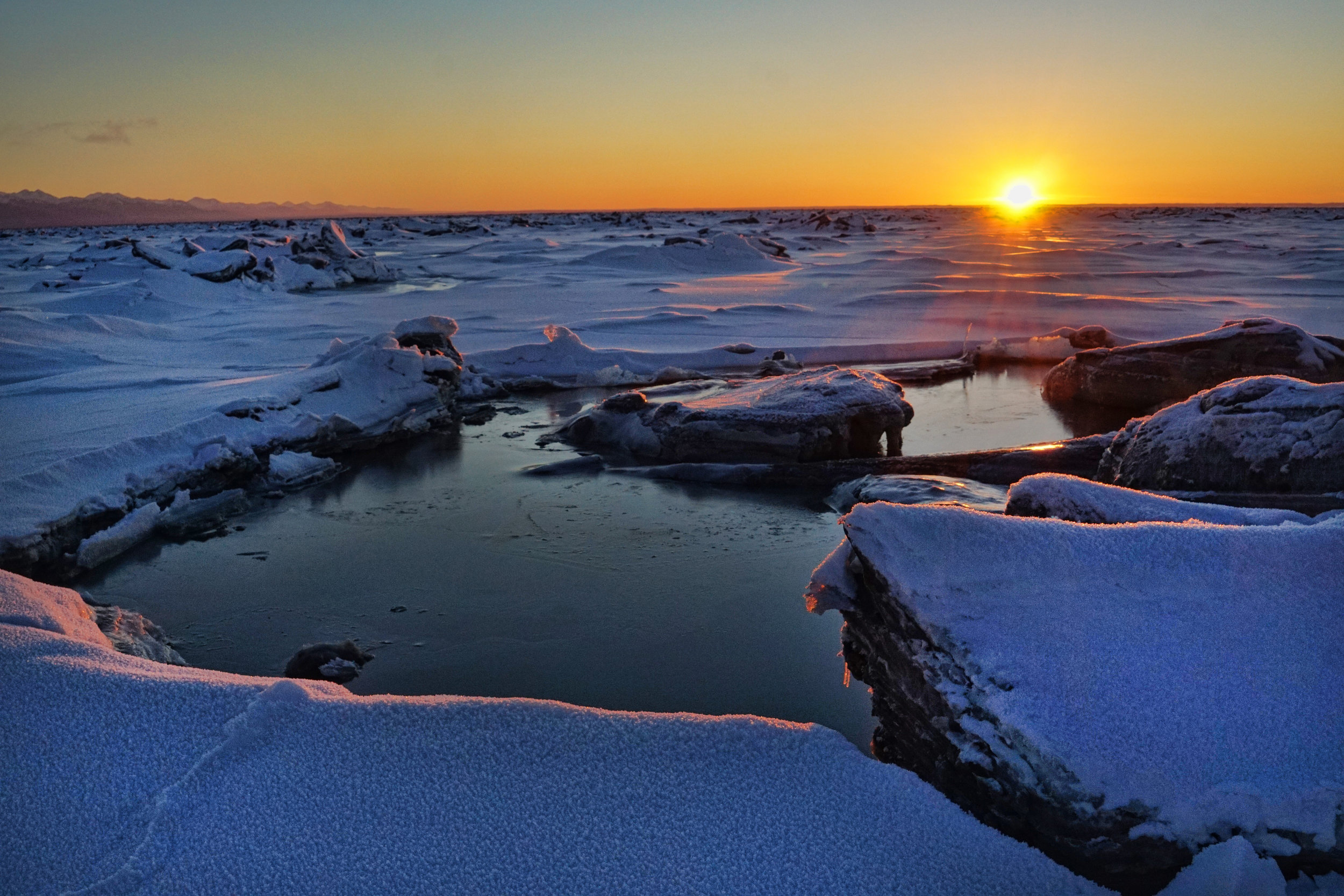 sunset over frozen sea.jpg