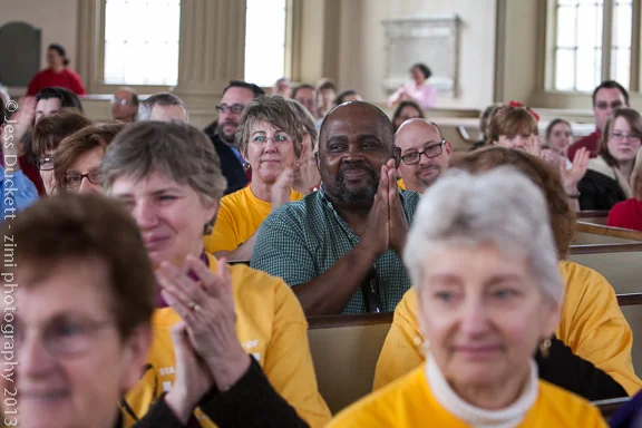 Congregants listen to Rev. Peter Morales in Rhode Island.