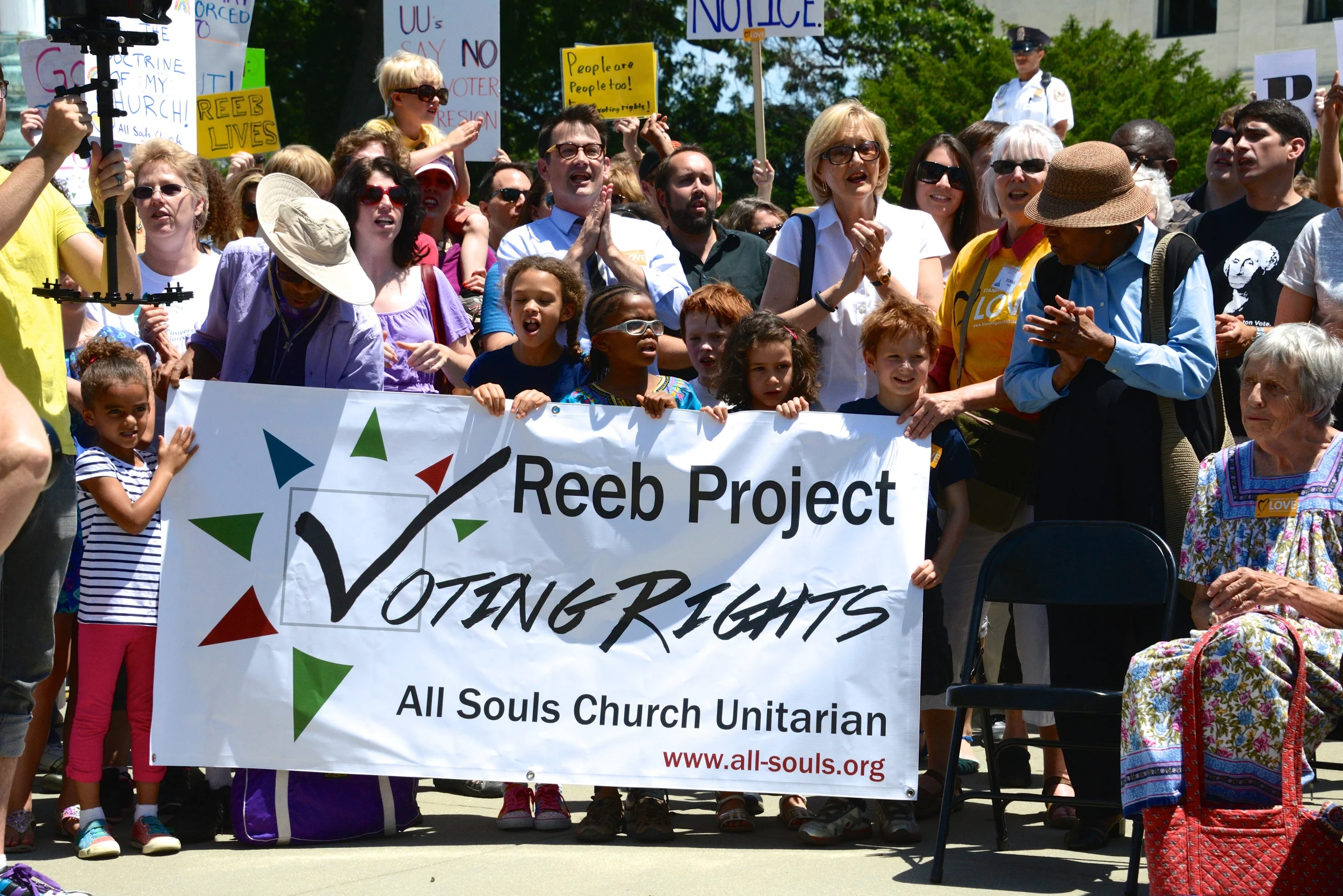 Rev. Rob Hardies of All Souls Unitarian in Washington, DC stands with over 300 of his parishioners on the steps of the Supreme Court as part of a Flash Mob for Voting Rights
