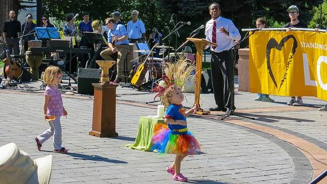 A young super-hero fairy dances on the side of love at the Annual Standing on the Side of Love Day in Denver, Colorado