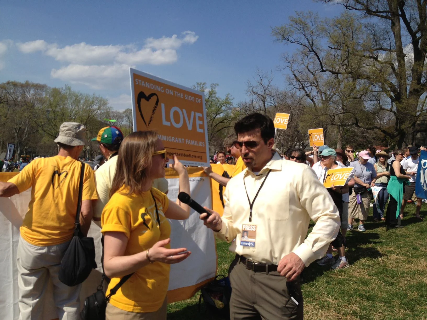 UUA Witness Ministries Leader Jessica Halperin speaks with a reporter during the Time is Now Rally for Immigration in 2013