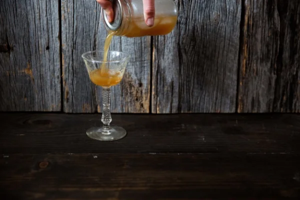 Straining from a mason jar.