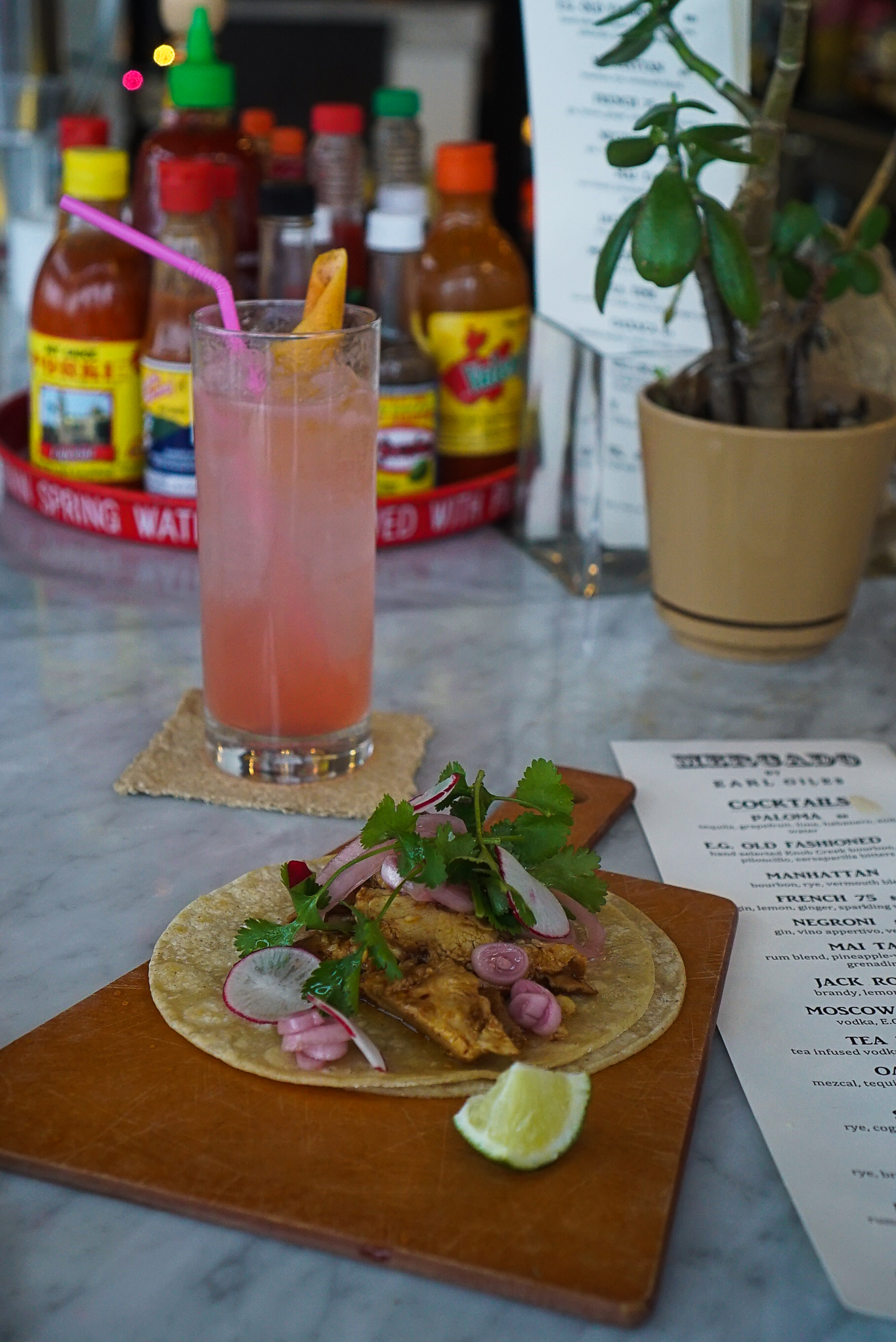 A Paloma & "Chicken Lady" tacos at Mercado