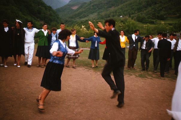 Circle dance with couple doing Eagle Dance in center