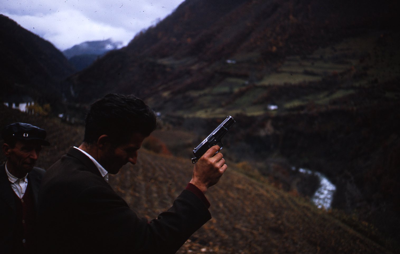 Man brandishing pistol—Montenegrins fired off their (illegal) firearms as a sign of joy, at tribal festivals and weddings (including indoors)
