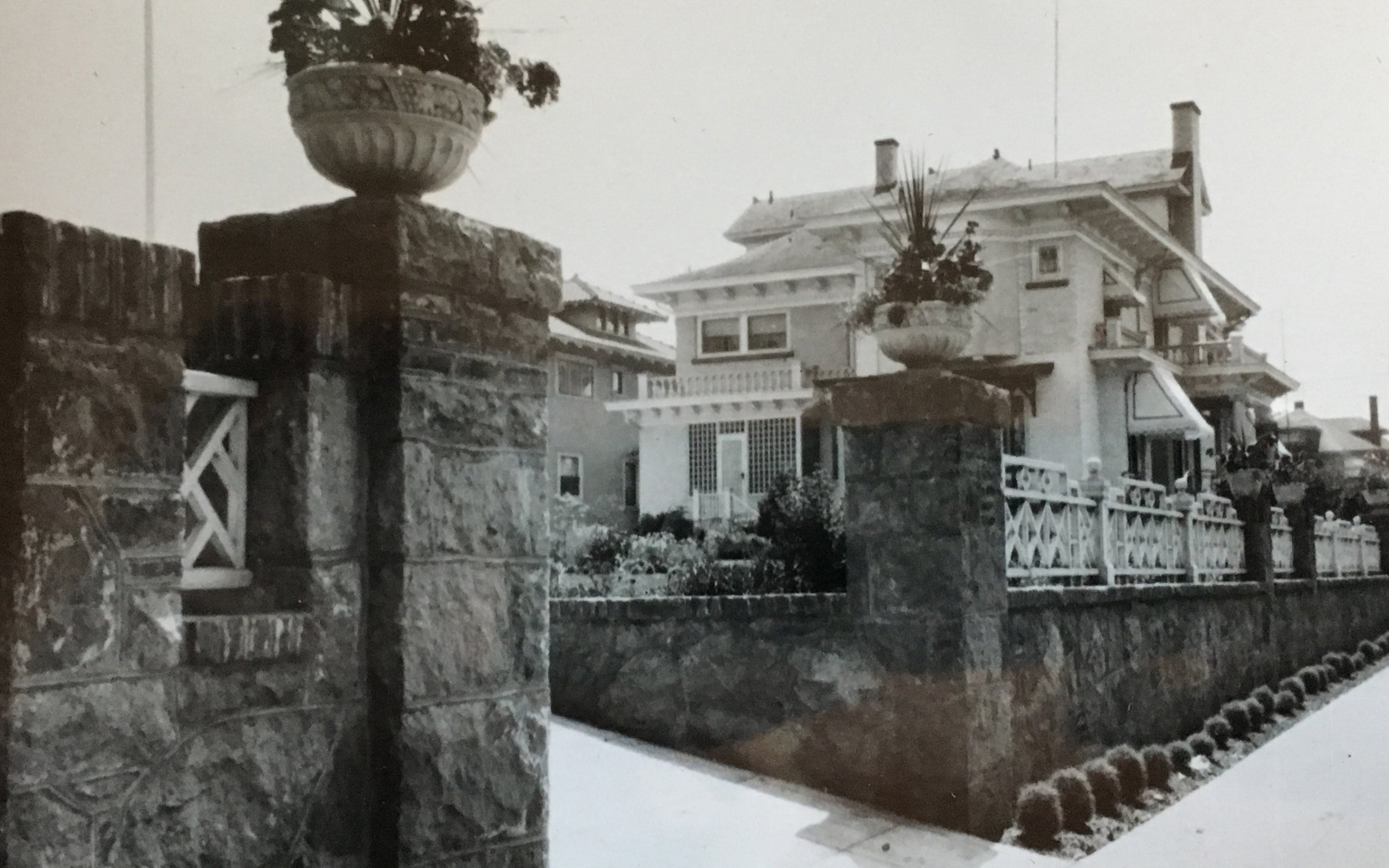  1609 NE Knott - looking down 16th street along the wall enclosing the garden, ca. 1920.&nbsp; 