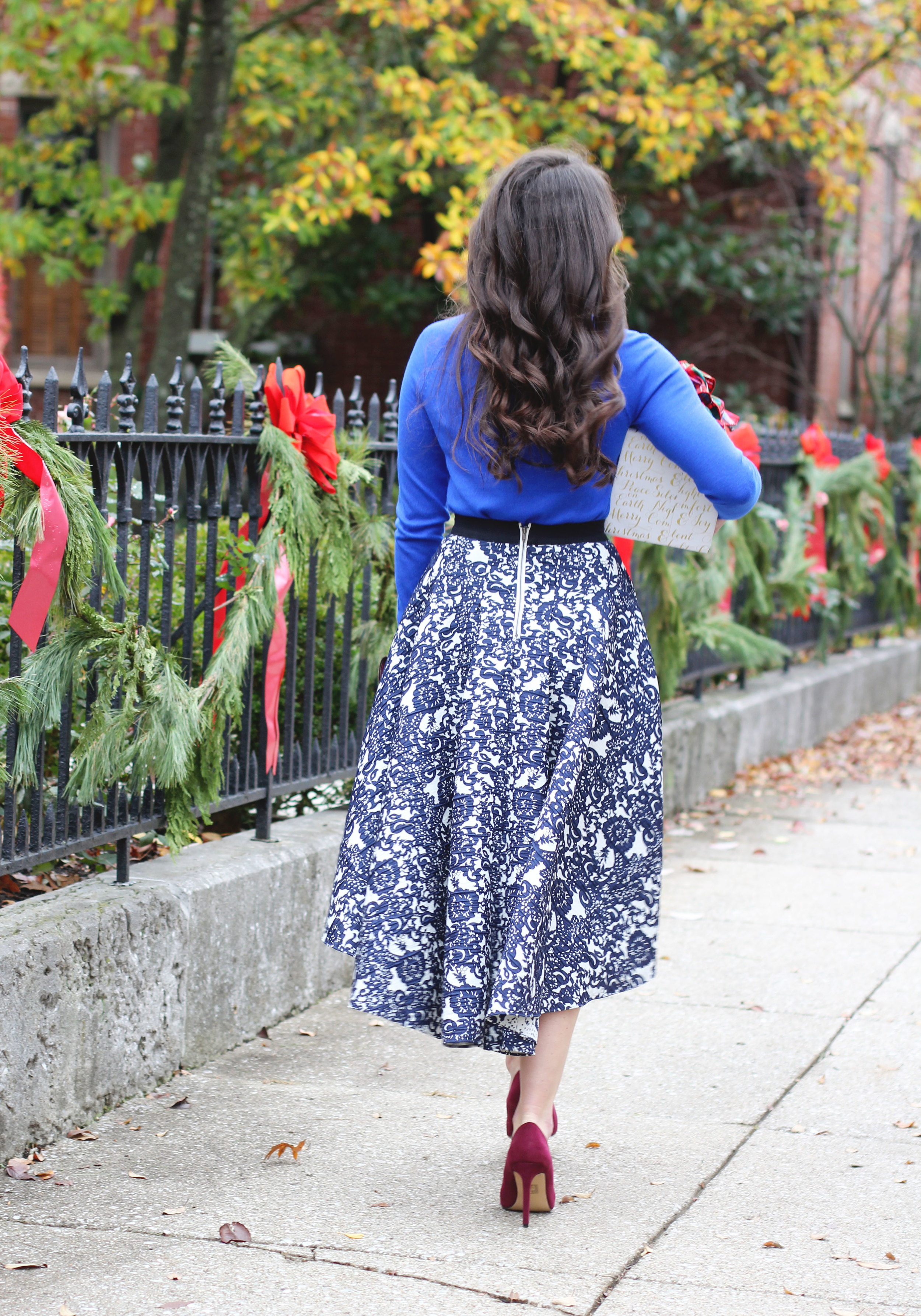 Holiday Outfit, Christmas Party Outfit, Anthropologie Vespertine High Low Skirt, Target Cobalt Blue Sweater, Wine Pumps, Rebecca Minkoff Envelope Clutch, Baublebar Courtney Bib Neclace