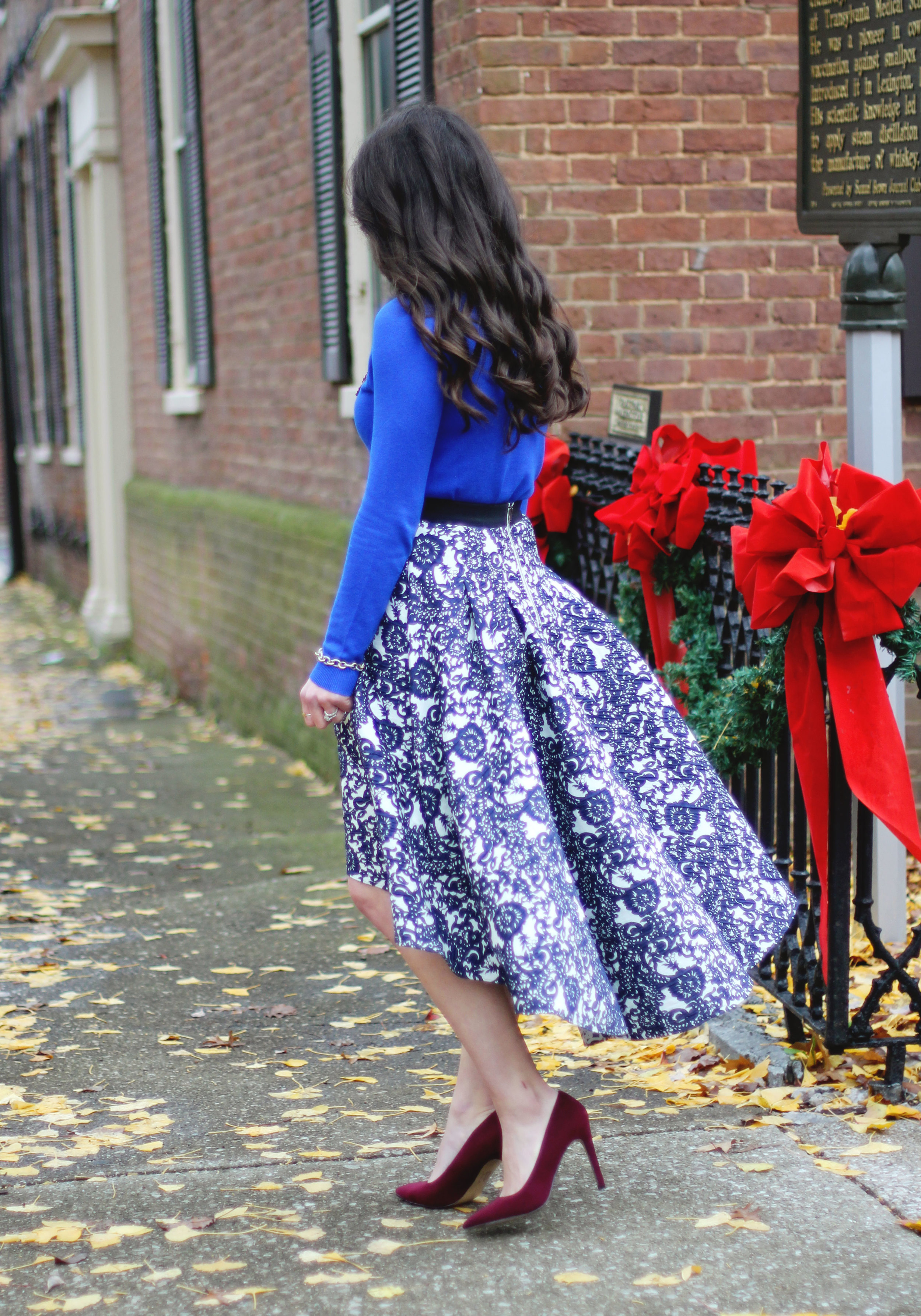 Holiday Outfit, Christmas Party Outfit, Anthropologie Vespertine High Low Skirt, Target Cobalt Blue Sweater, Wine Pumps, Rebecca Minkoff Envelope Clutch, Baublebar Courtney Bib Neclace