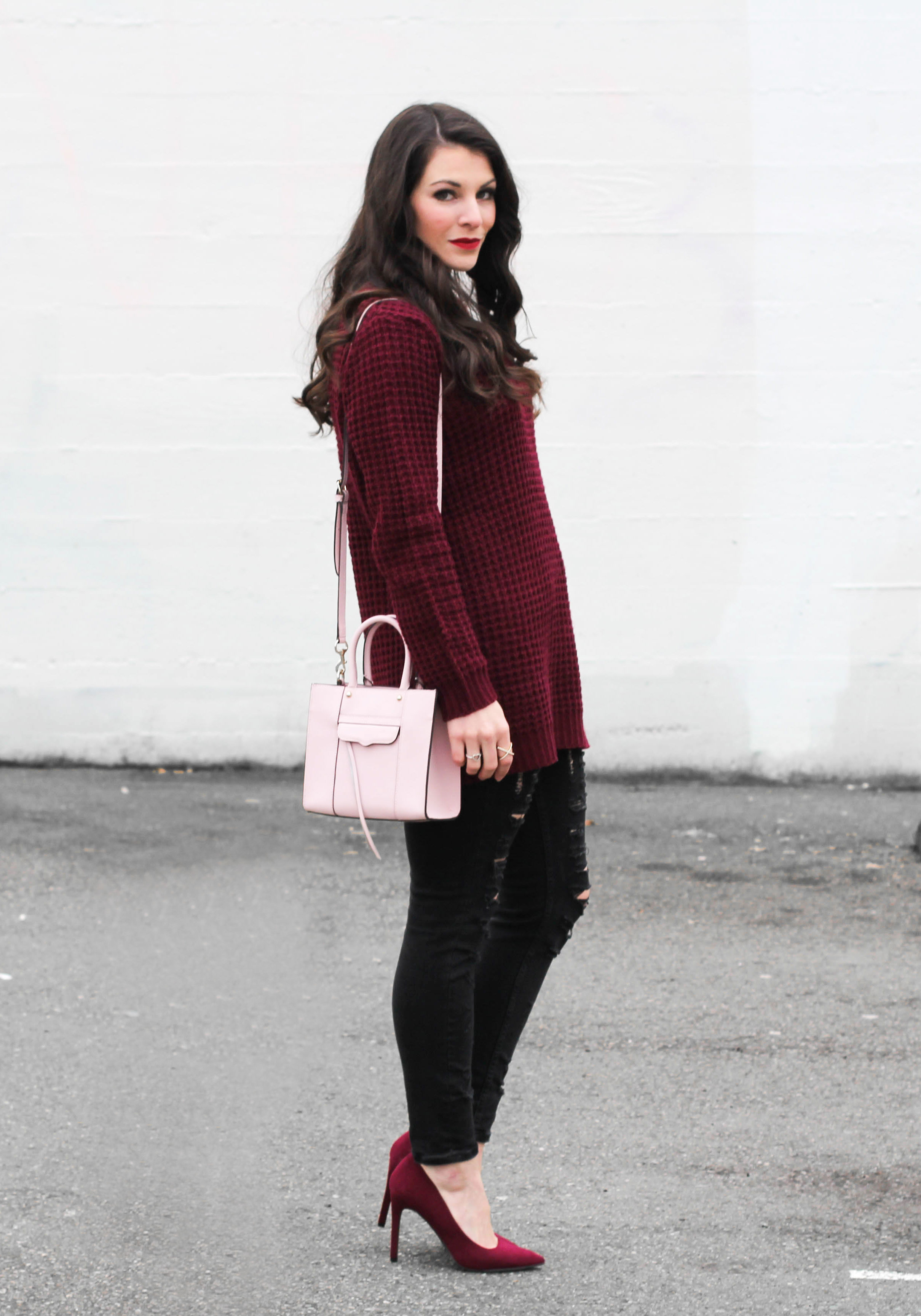 Casual Valentine's Day Outfit, Burgundy Tunic Sweater, Burgundy Pumps, Light Pink Rebecca Minkoff Mini Mab Tote, Black Destroyed Jeans, Dior Look Alike Sunglasses