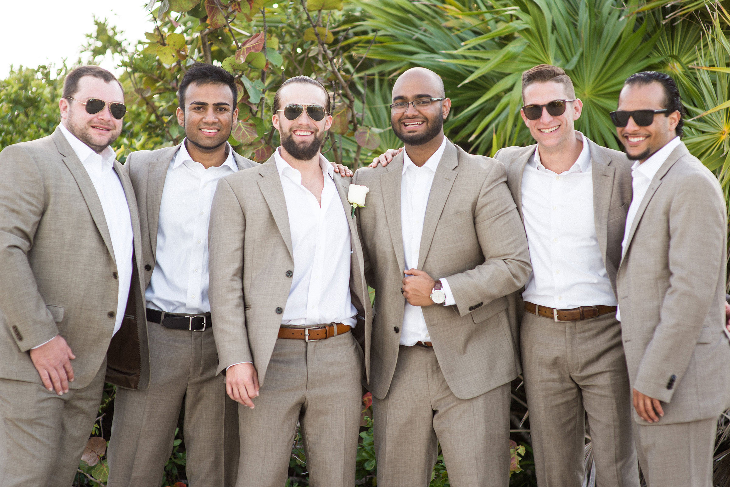 Groom and groomsmen in tan suits for beach wedding.  Destination wedding in Mexico.