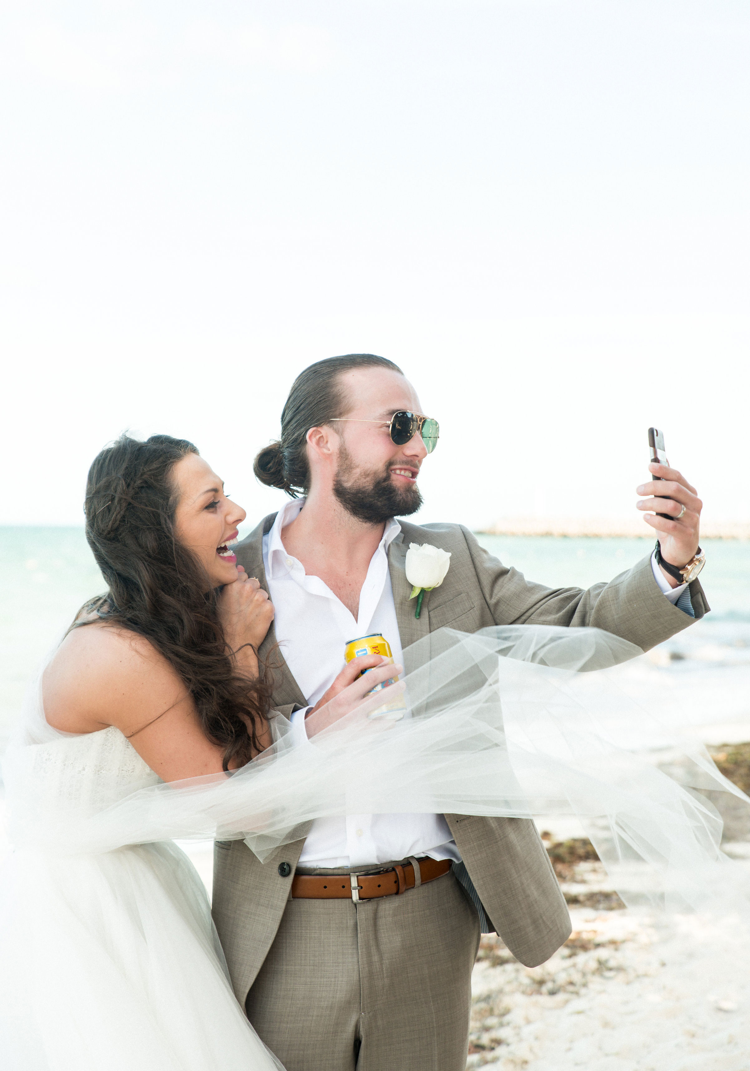 Bride and Groom facetiming family who couldn't be at their destination wedding in Mexico.