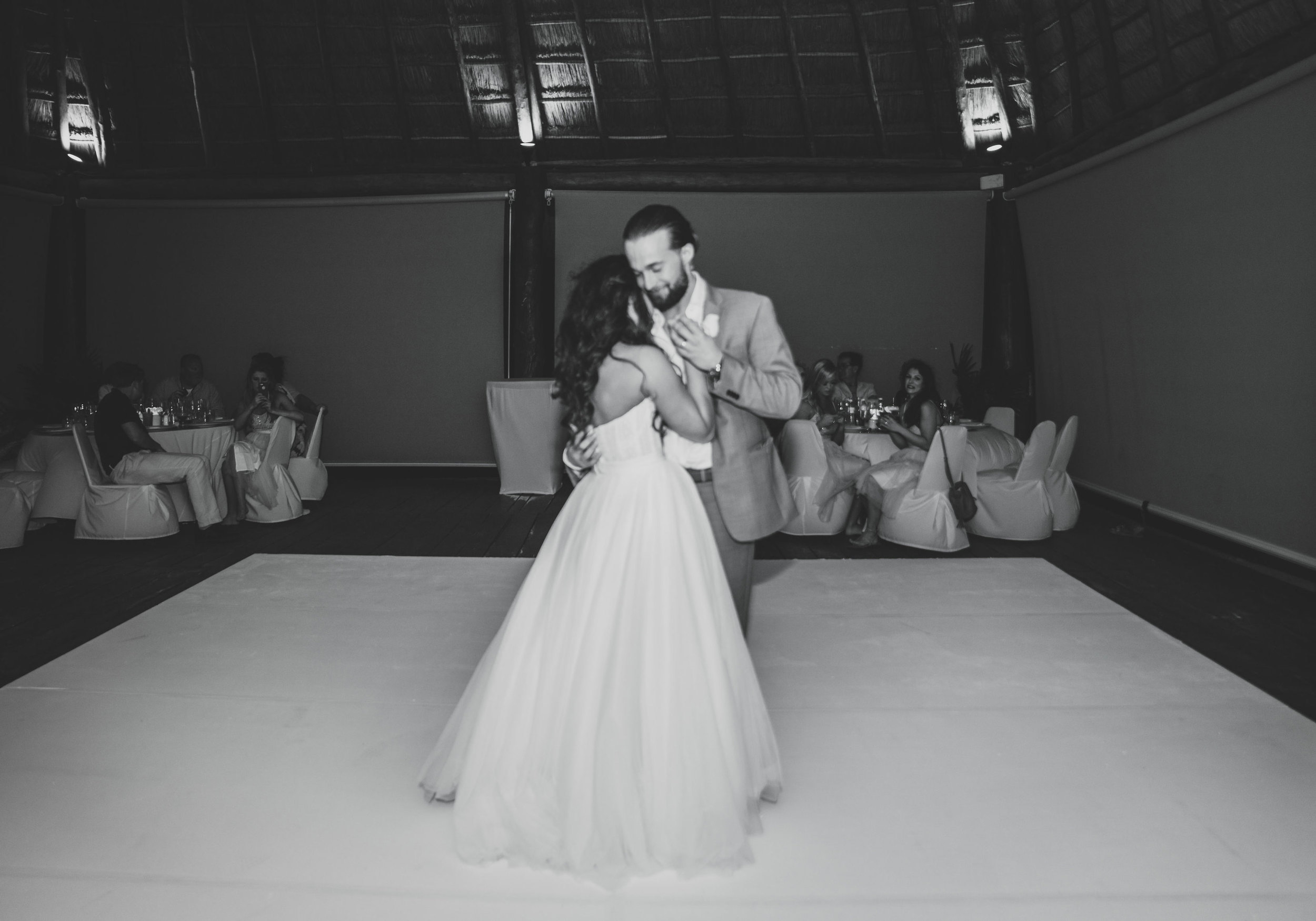 Destination wedding in Mexico, bride and groom's first dance, Groom with a man bun. 