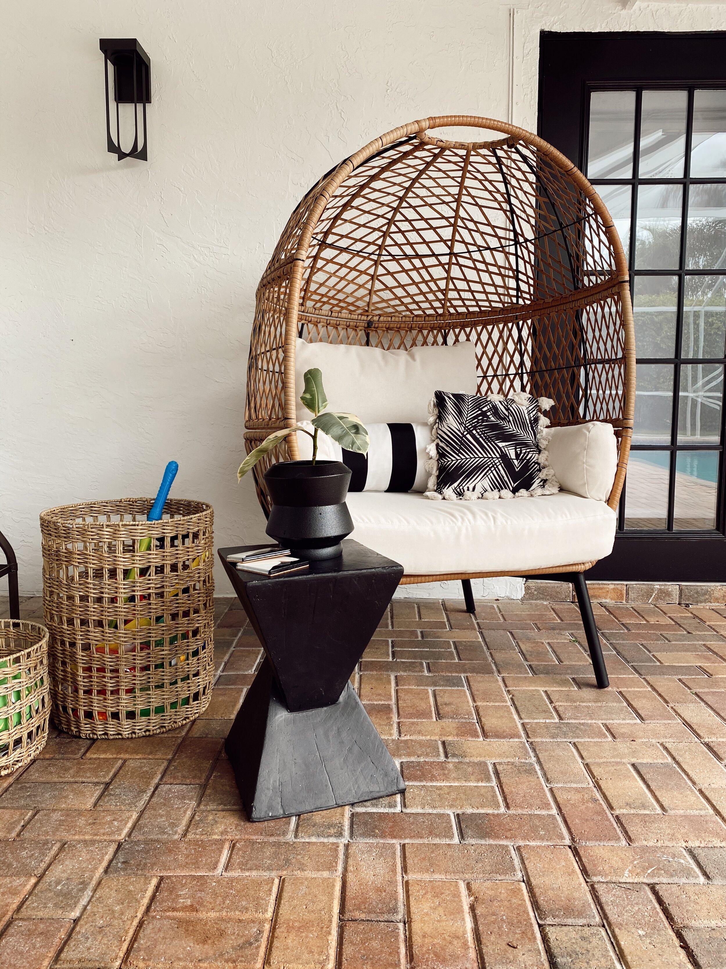 Me & Mr. Jones patio decor.  Modern outdoor furniture and decor from Walmart, Amazon, and Target.  Walmart Ventura egg chair.  Black & white outdoor space.