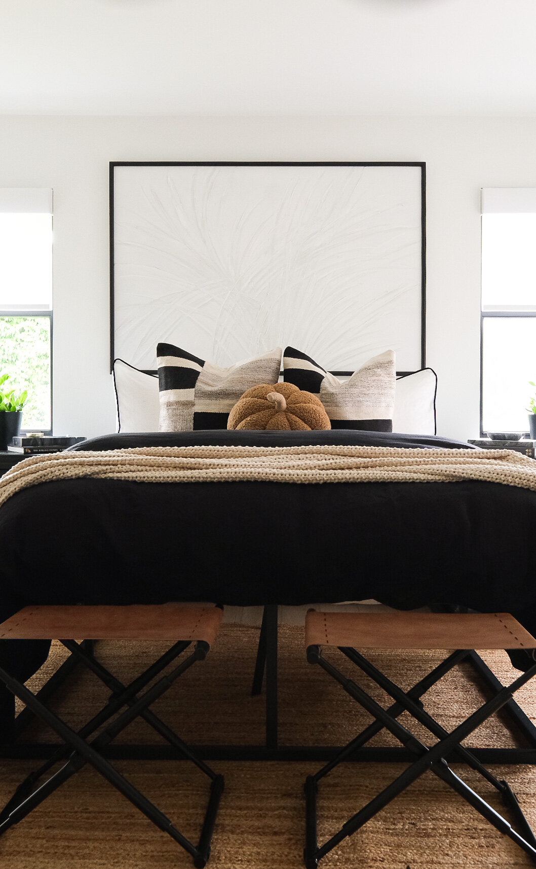 https://images.squarespace-cdn.com/content/v1/5449a23fe4b04f35b928c028/1630545993801-K3IGGL45SKQS82IIF70S/Fall+bedding+ideas.++Black+linen+duvet+cover%2C+Casaluna+bed+blanket%2C+black+and+ivory+pillows%2C+pumpkin+pillow%2C+and+white+shams.++Jute+rug+and+leather+ottomans+in+front+of+bed.