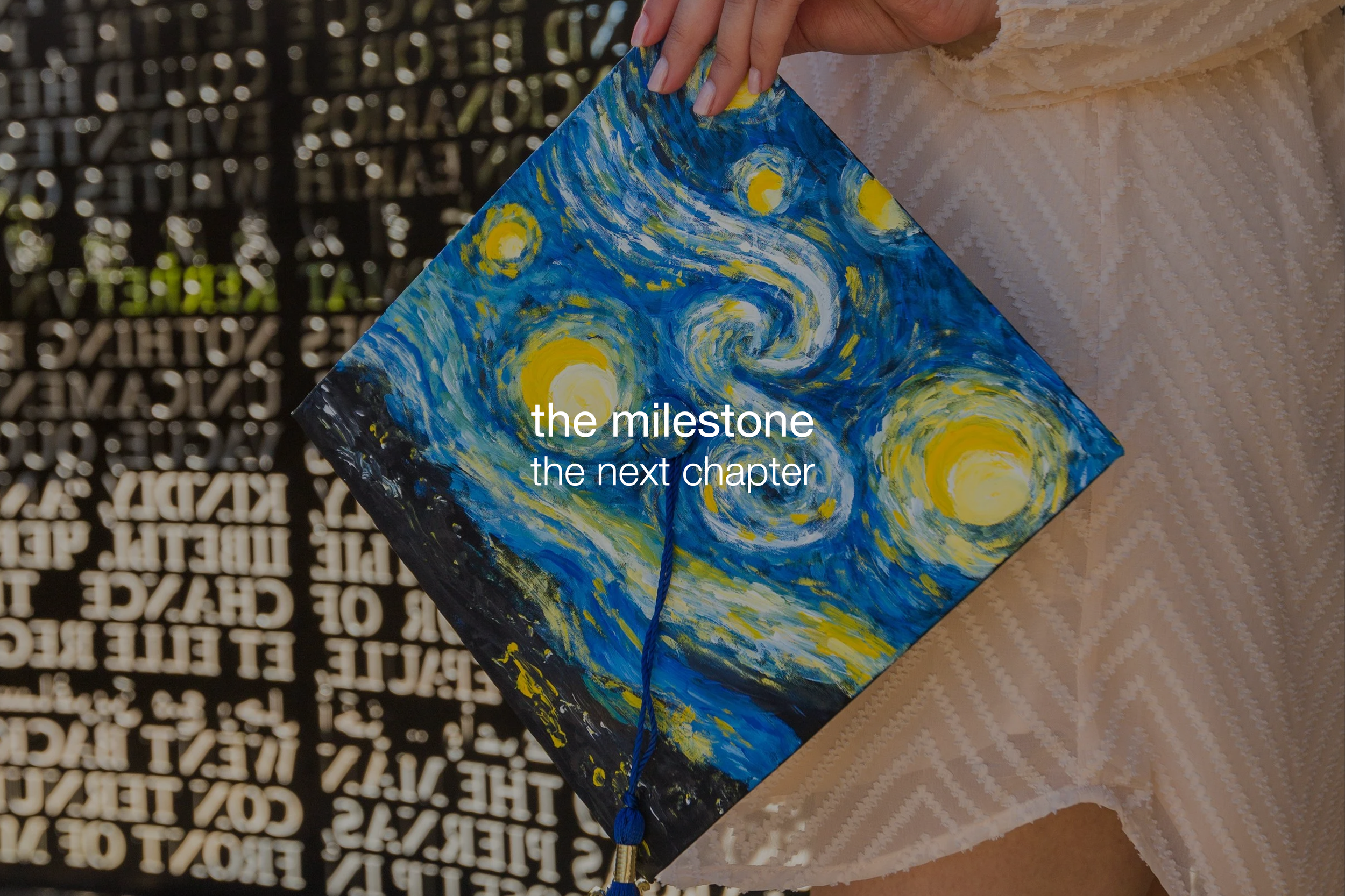 A person holding a square painting of swirling blue and yellow brushstrokes resembling Vincent van Gogh's "Starry Night". The person is wearing a textured cream-colored garment, and a dark string or cord is attached to the painting. The background ha