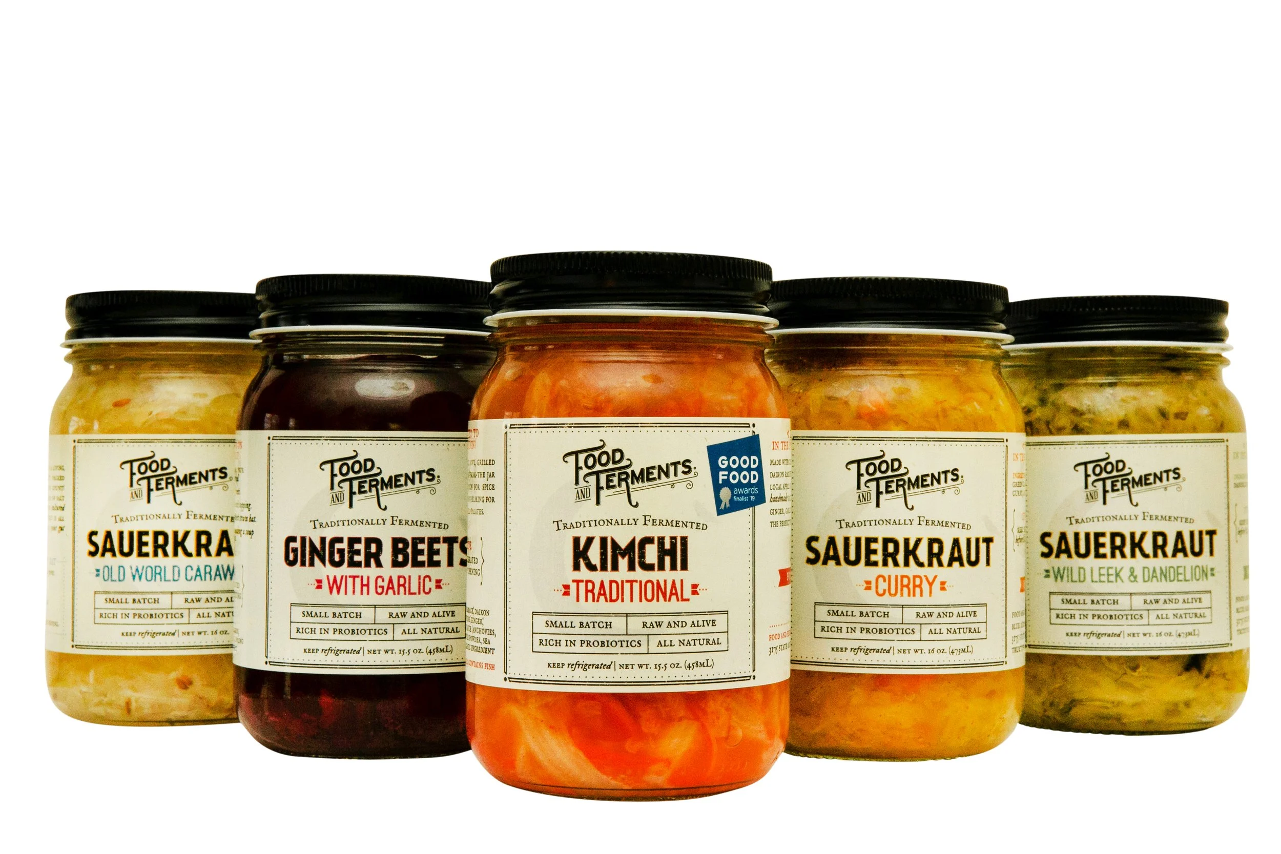All of our small-batch Sauerkraut flavors in a row on a white background.