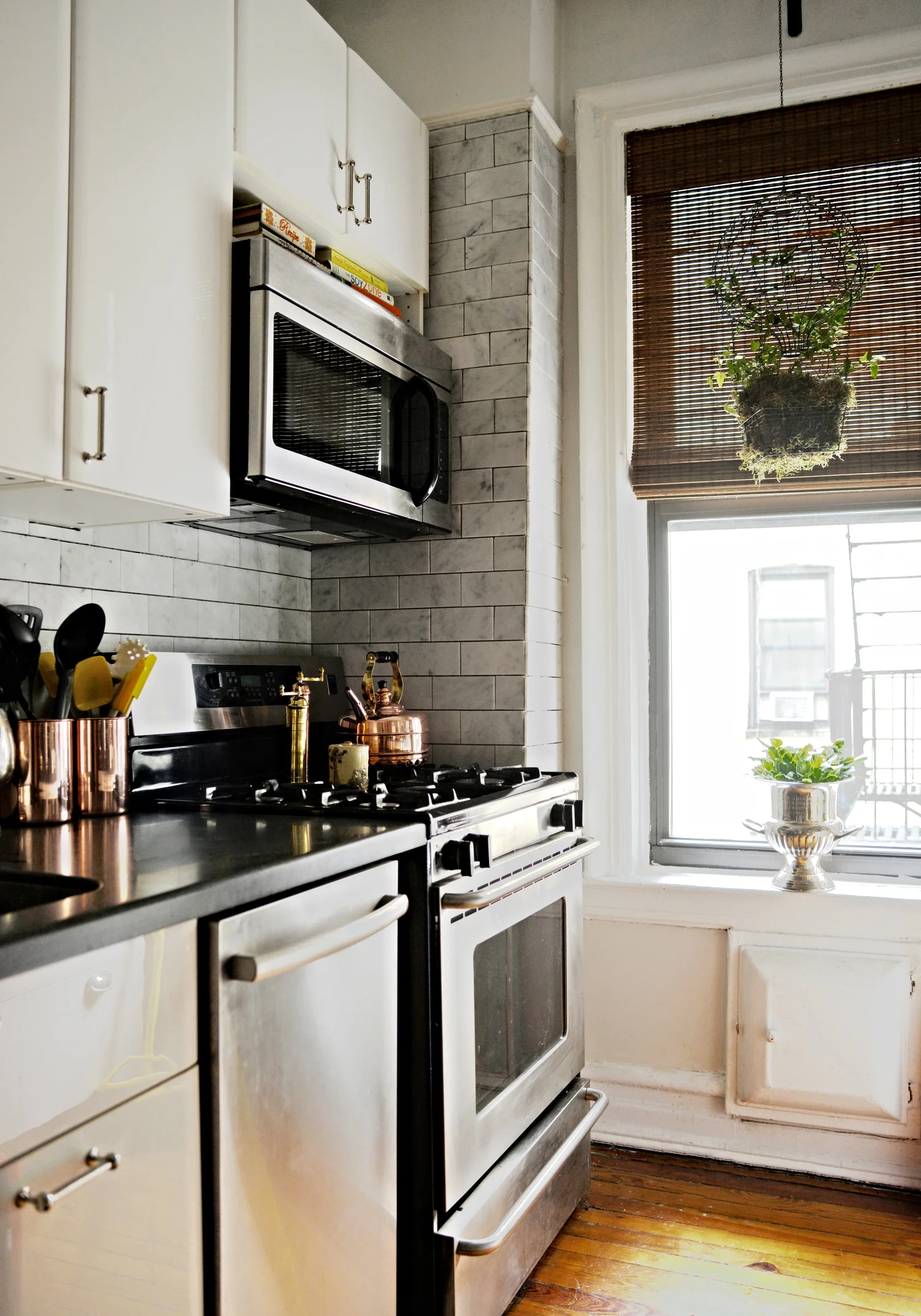 My Kitchen - The recent update of my kitchen, with the almost finished backsplash, and the new copper accessories to bring in a touch of warmth. Photography by Lauren L Caron © 2015