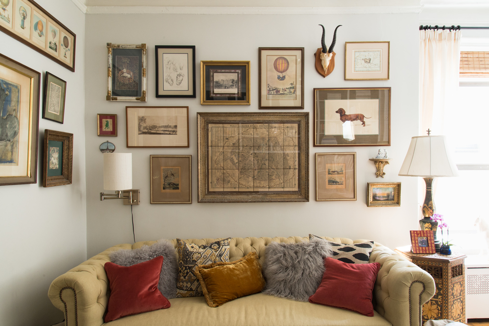 my favorite gallery wall in the home that holds my favorite prints / that sofa doubles as a guest bed.