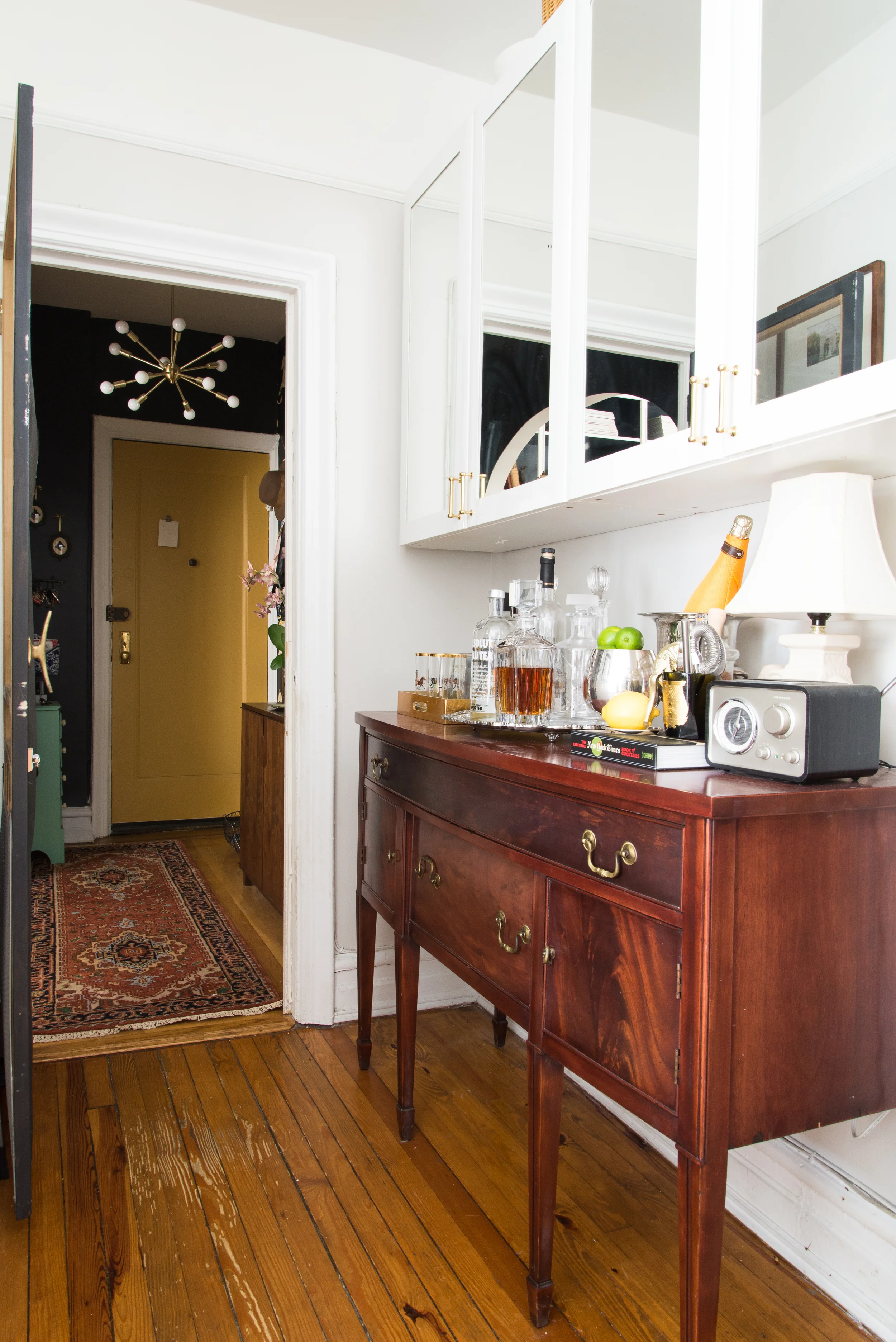 Finding that sideboard has added so much storage to once was a useless bar. 