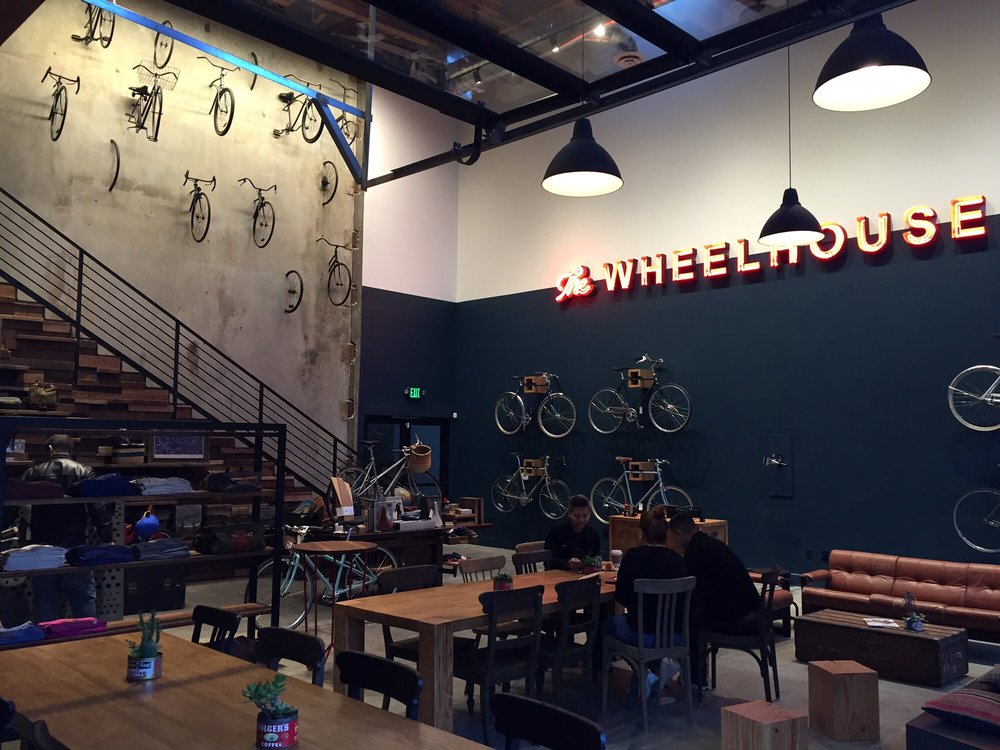 People sit side-by-side with bikes at The Wheelhouse