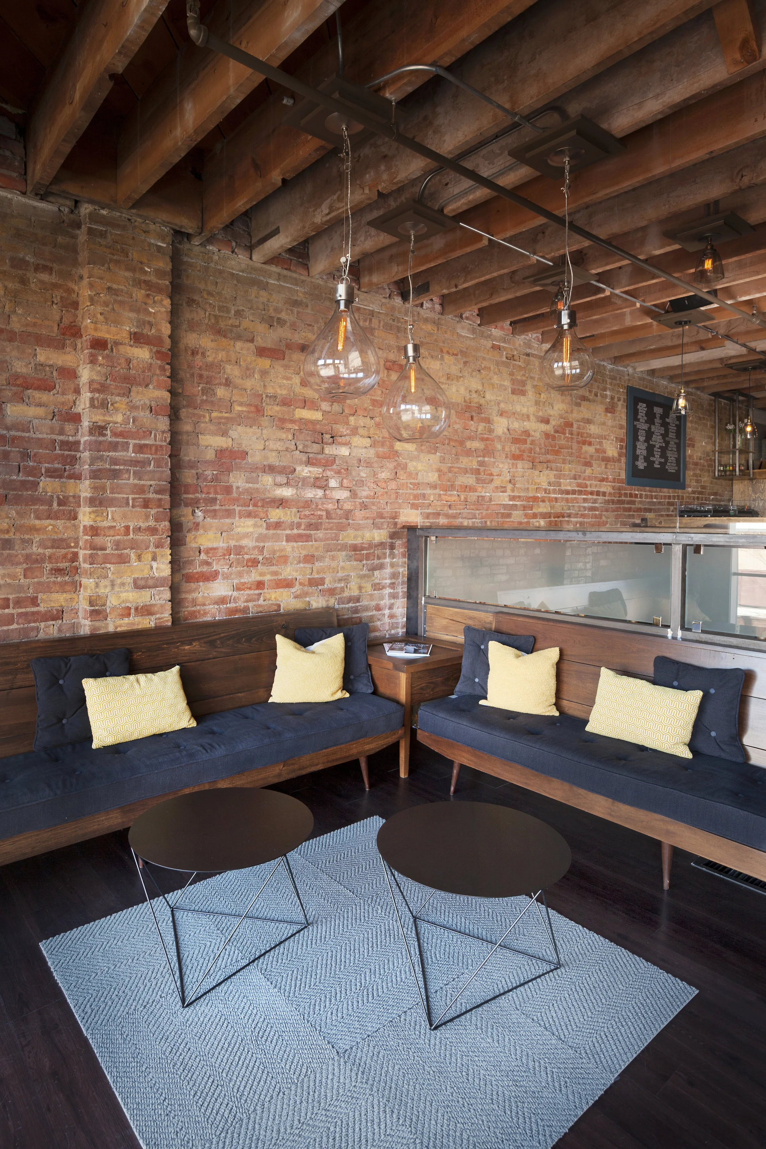 Custom mid-century modern built-in sofas and side table. 