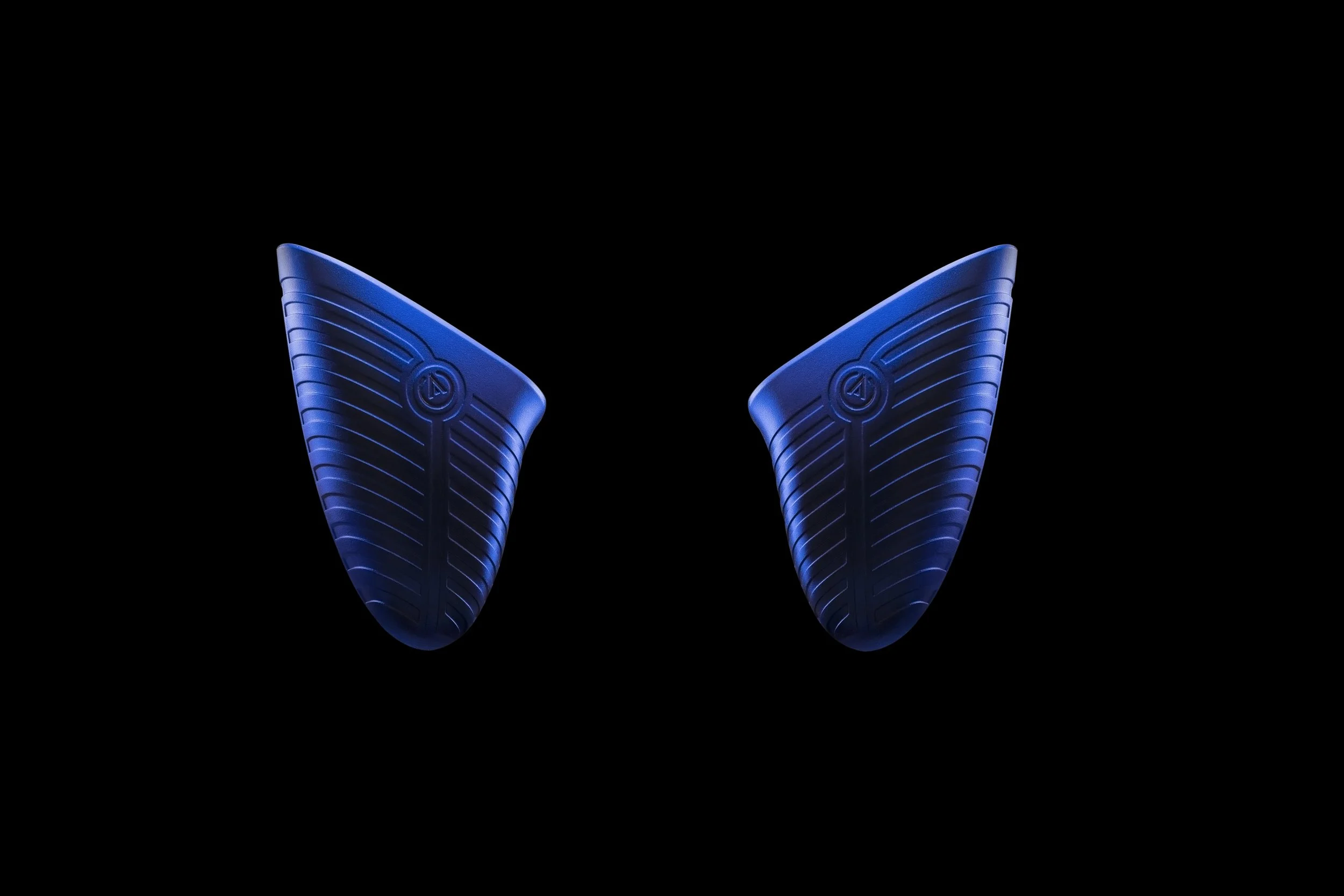 Two blue, sleek, wing-shaped video game controller handle with textured curves are positioned symmetrically against a black background, creating a futuristic and aerodynamic appearance.