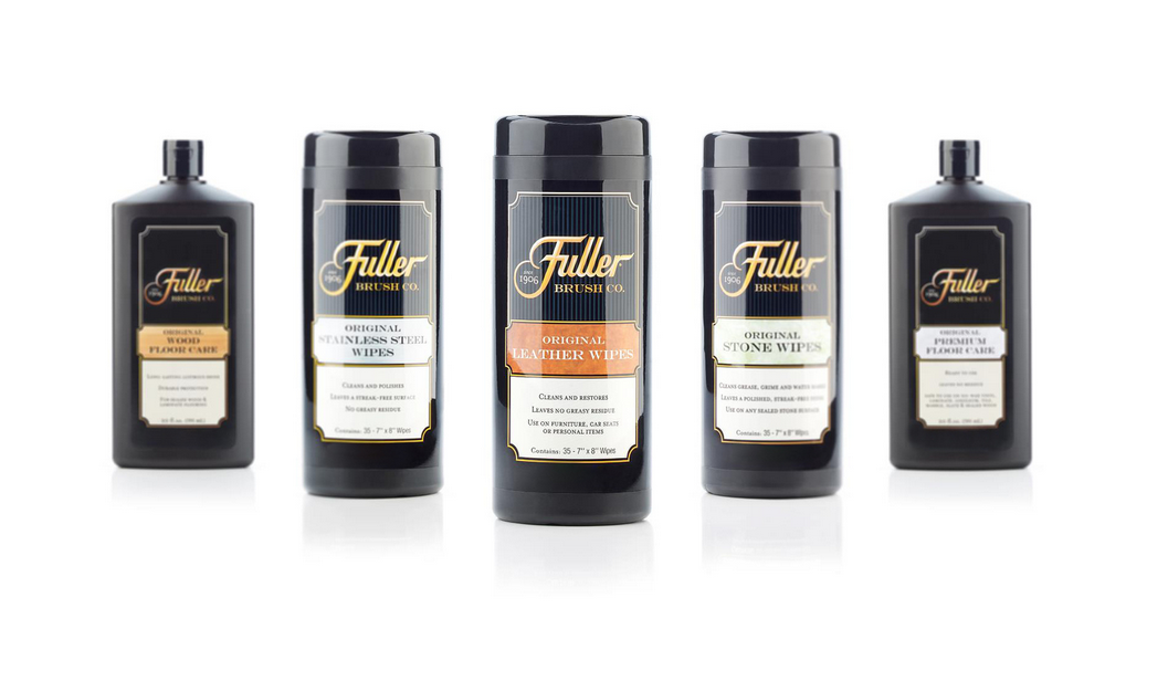 A lineup of five Fuller Brush Co. cleaning products, including leather wipes, stone wipes, and plastic care solutions, arranged in a row against a white background.