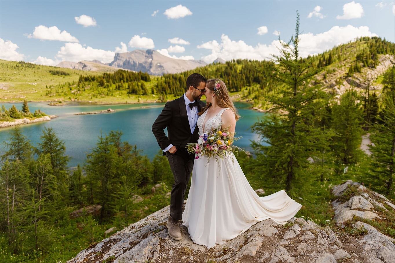 Robyn and Chris eloped on a hot summer day in the Canadian Rockies. They started their day with a beautiful ceremony by the lake, with their closest friends and family present. In the afternoon we went for a hike and were surrounded by the most incre
