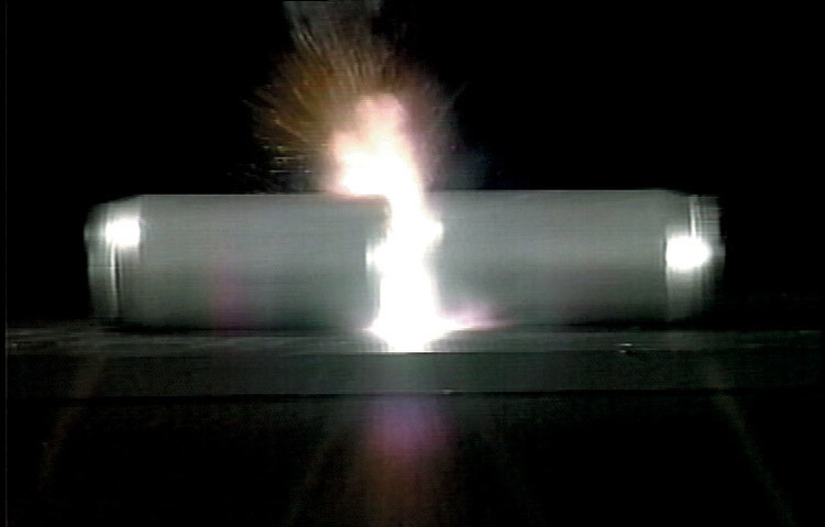 CONSERVATION OF MOMENTUM DEMONSTRATED BY INTERNAL EXPLOSION.