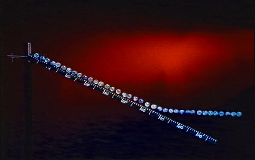 the outer third of a hinged meterstick falls with an acceleration greater than g.
