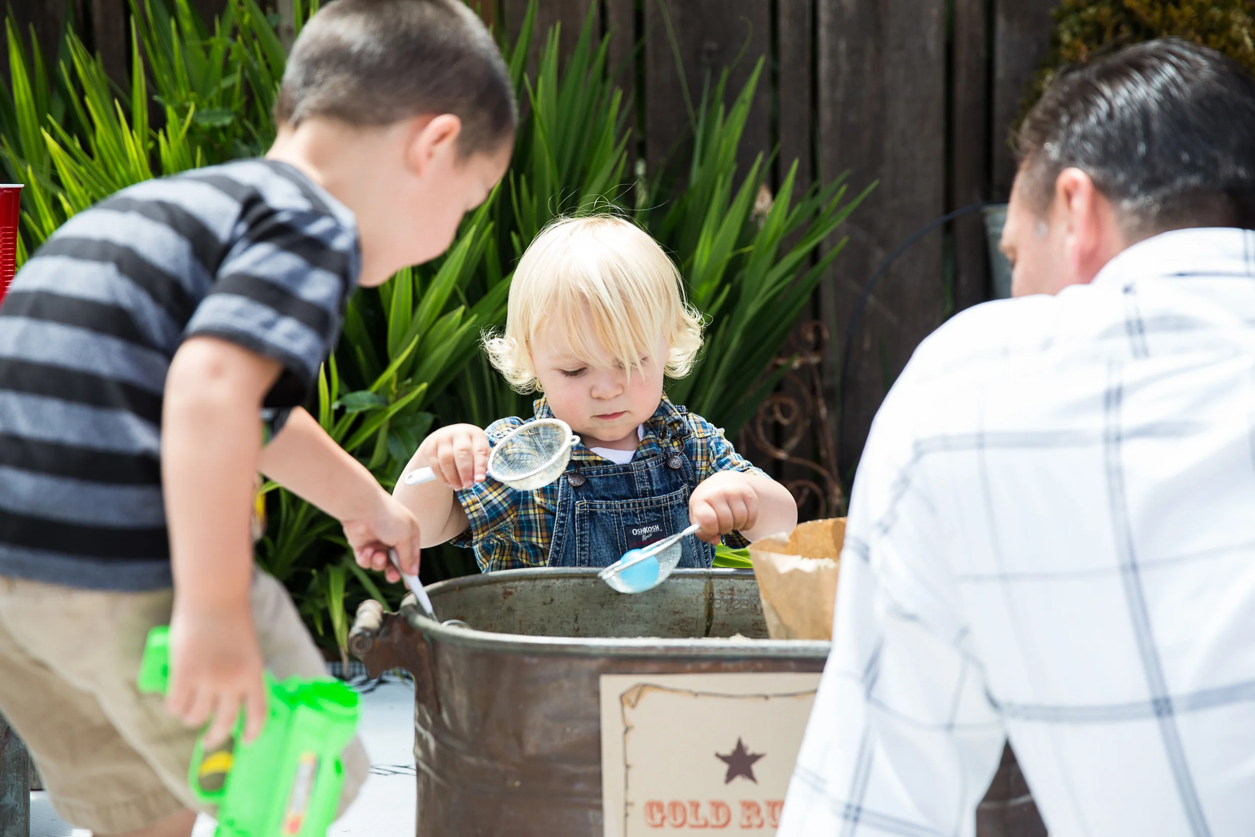 Gold Rush (dig for gold!). I picked up some kiddie sand at Home Depot, poured it into a container along with some plastic gold coins and dollar signs. The kids had a blast sifting through the sand for treasures.