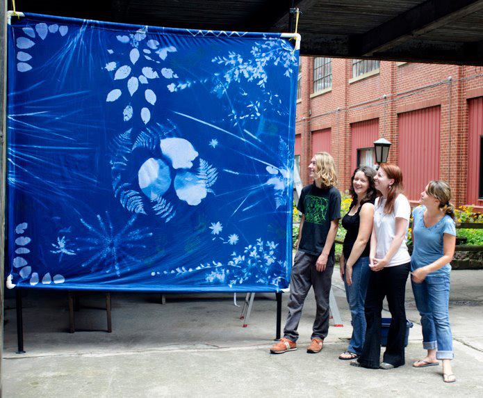 Miles and fellow Darkroom classmates with their cyanotype print. (2012). Photograph by Ralph Wilson.