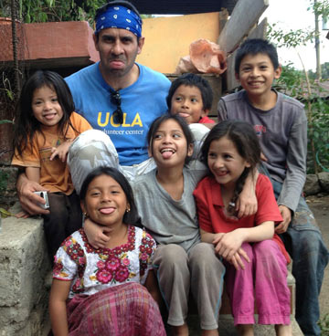 Dr. Jarrahy and village children mug for the camera.