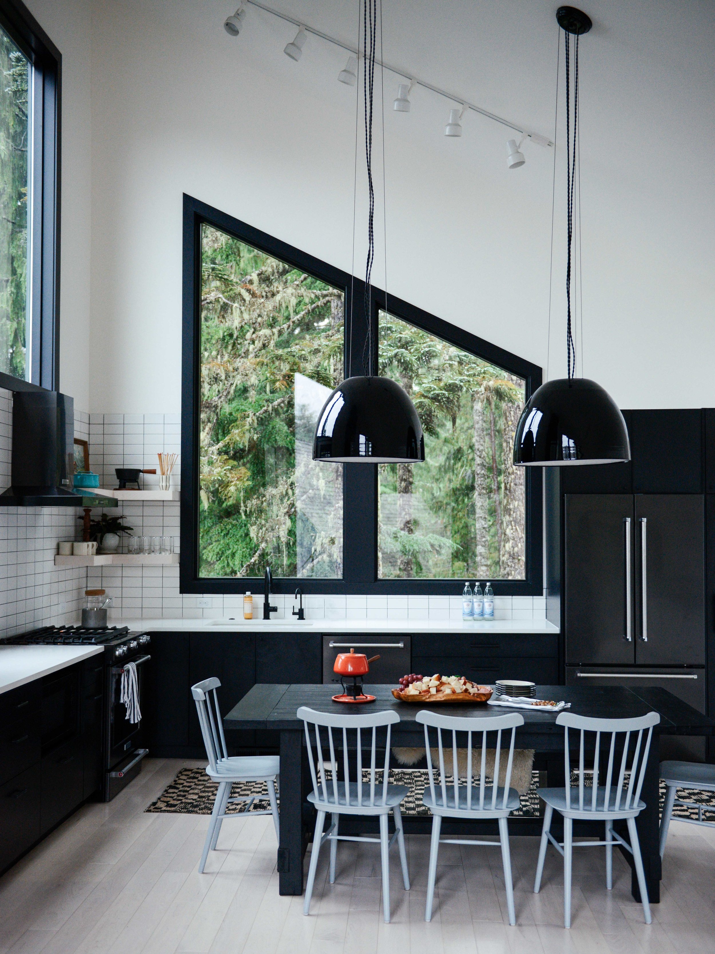 Modern Black & White Mountain Cabin Kitchen with Schoolhouse Pendants | Casework Interior Design | Portland, OR