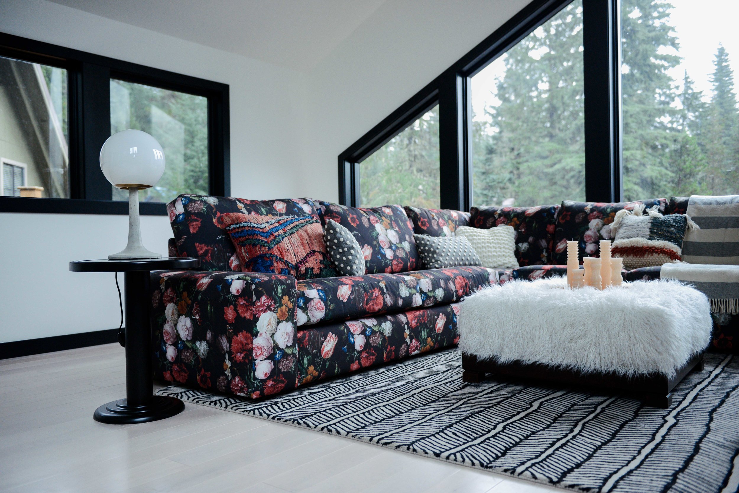 Modern Black & White Mountain Cabin Living Area with Custom Floral Sofa | Casework Interior Design | Portland, OR