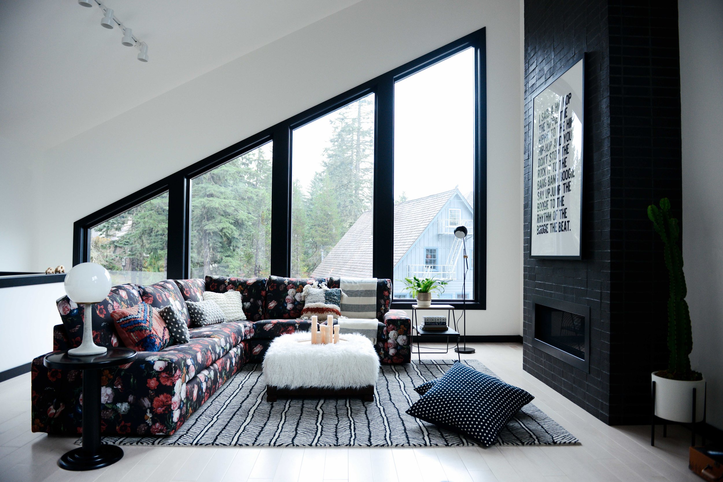 Modern Black & White Mountain Cabin Living Area with Custom Floral Sofa | Casework Interior Design | Portland, OR