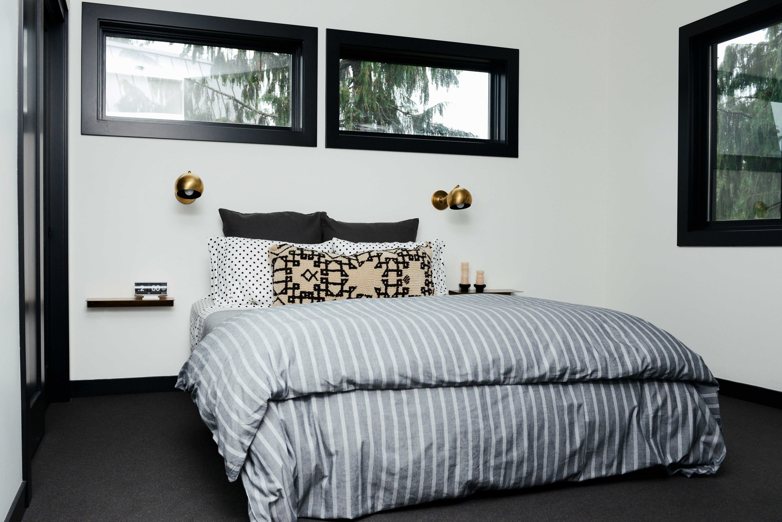 Modern Black & White Mountain Cabin Master Bedroom with Brass Schoolhouse Sconces | Casework Interior Design | Portland, OR