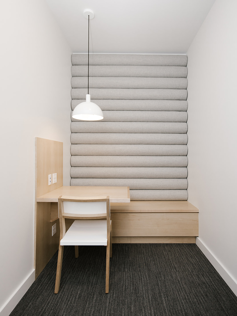 Bright Open Office Phone Room with Custom Upholstered Wall | Casework Interior Design | Portland, OR