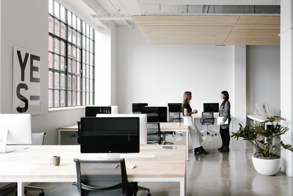 the office spaces are set up for flexibility custom made desks include hidden troughs for wire management and accessibility - Things to Consider, When Choosing an Office Space