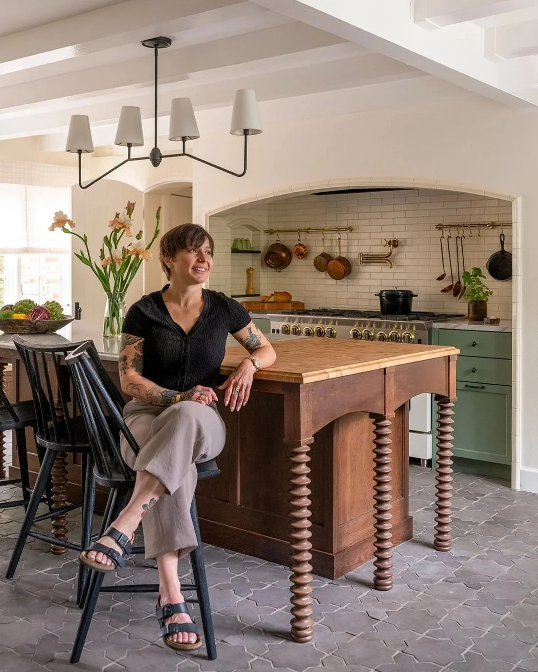 Historic home kitchen featuring custom cabinetry and natural stone surfaces