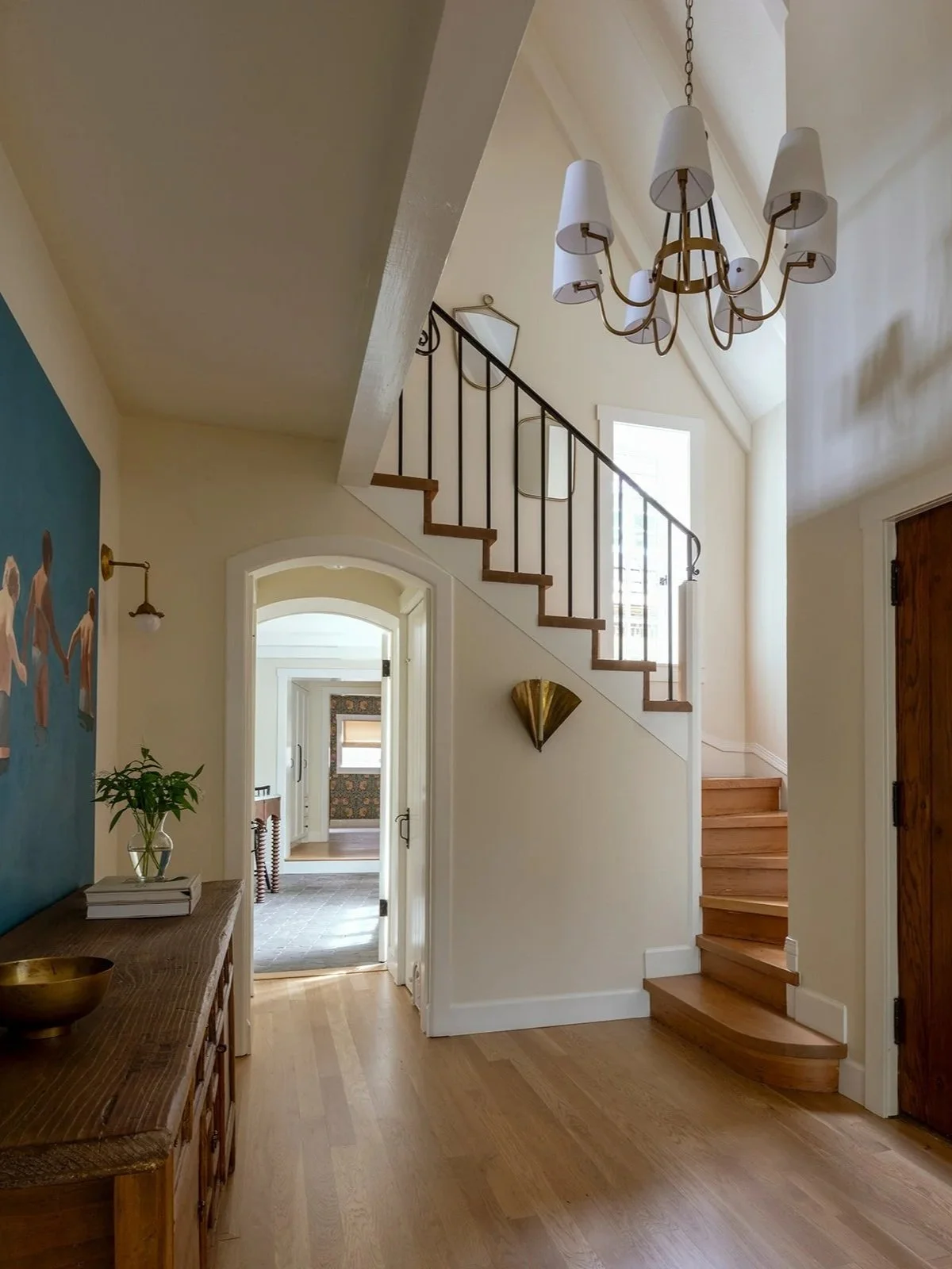 Historic entry hall with restored millwork and updated lighting