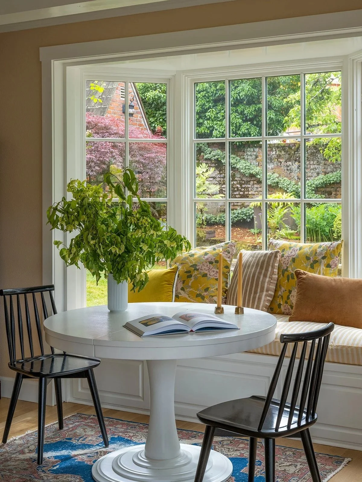 Restored living space featuring original millwork and contemporary furnishings
