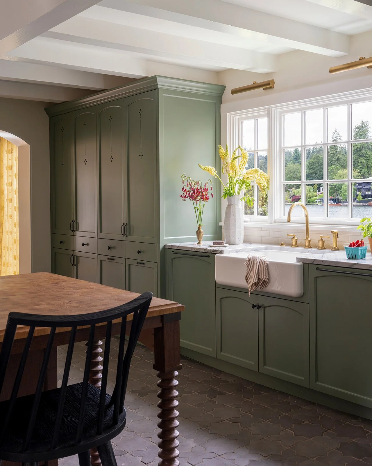 Period-inspired kitchen design with modern functionality and lake views