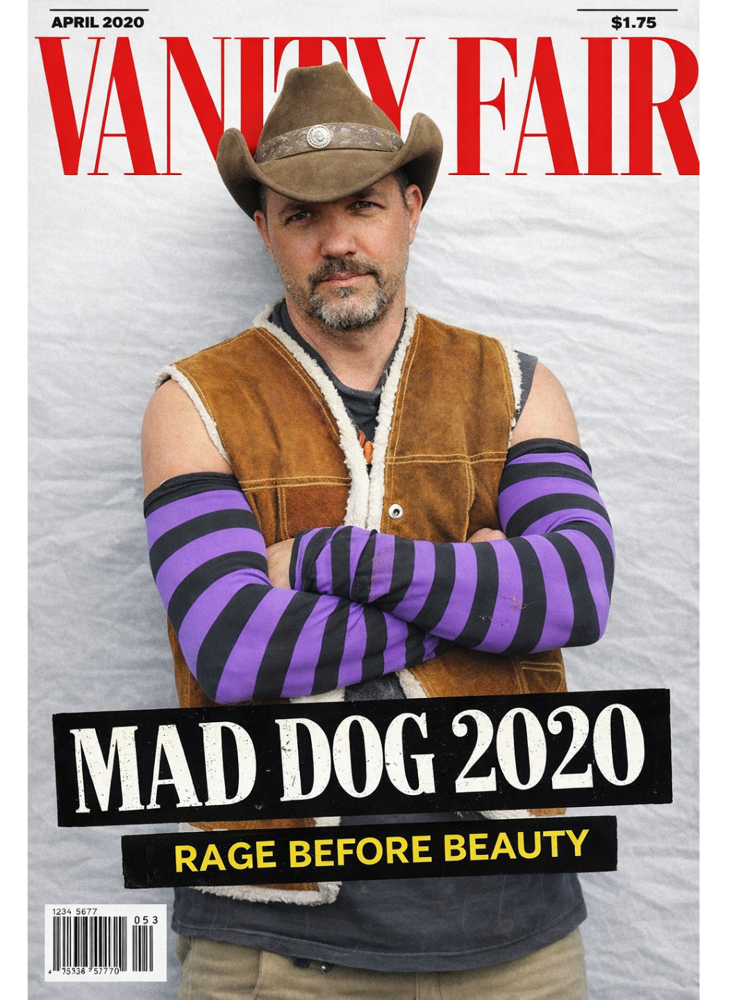 Mad Dog Madigan posing in front of a Vanity Fair magazine cover backdrop, wearing a western hat and vest, creative director and live event designer.