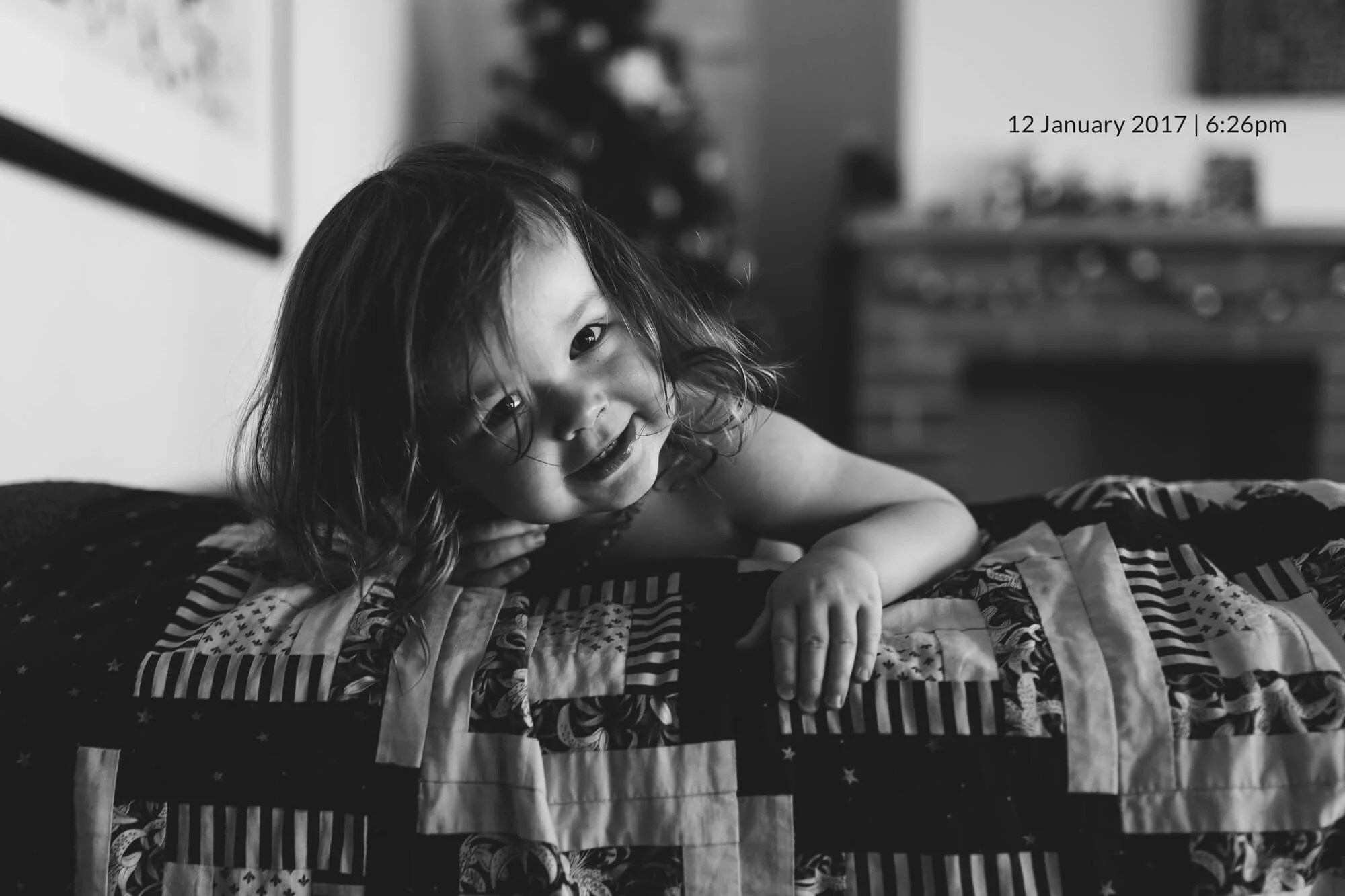 Family photographer in Melbourne. Black and white portrait of a toddler.