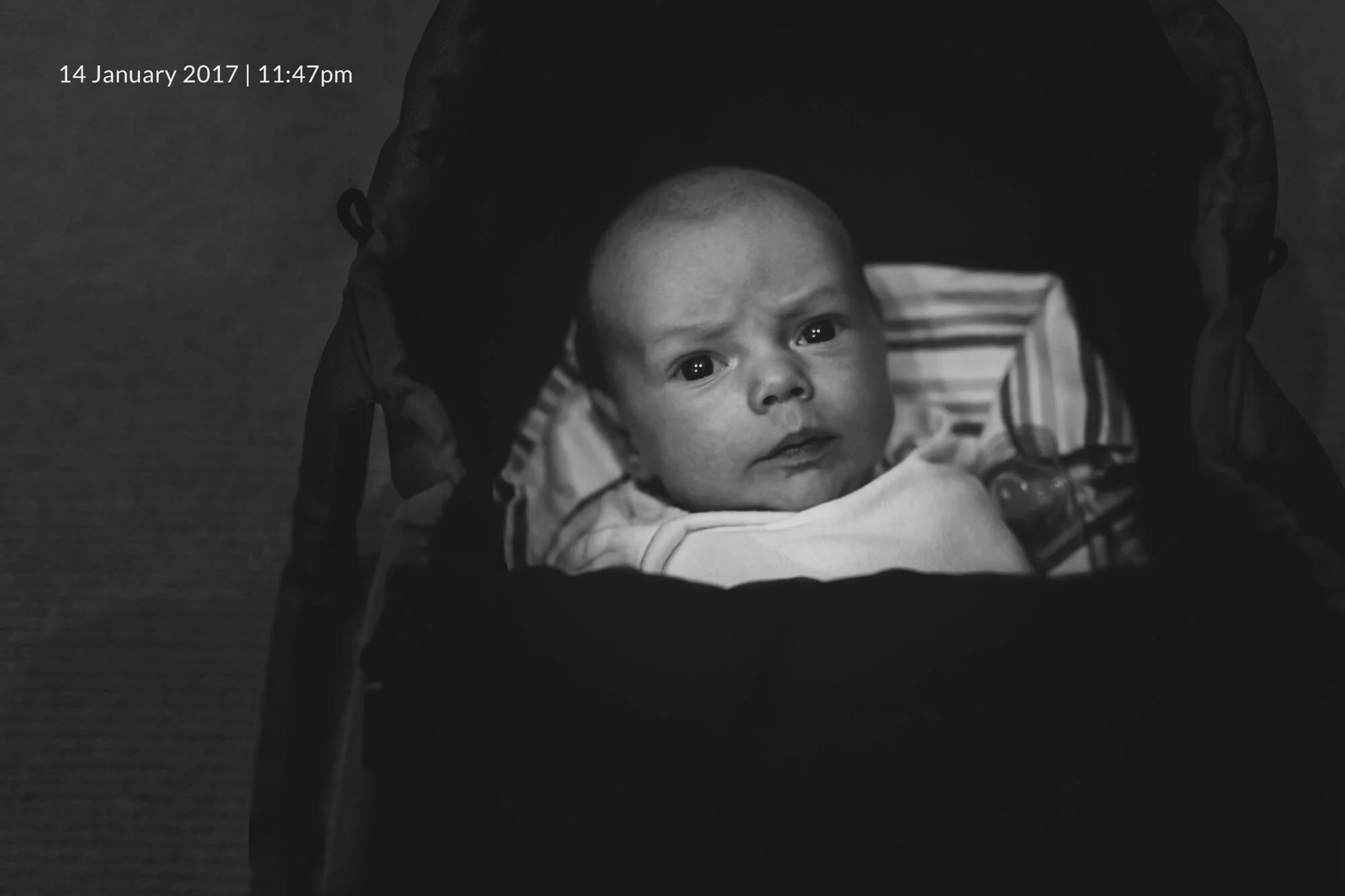 Newborn lifestyle photographer in Melbourne. Black and white lifestyle portrait of a newborn baby.
