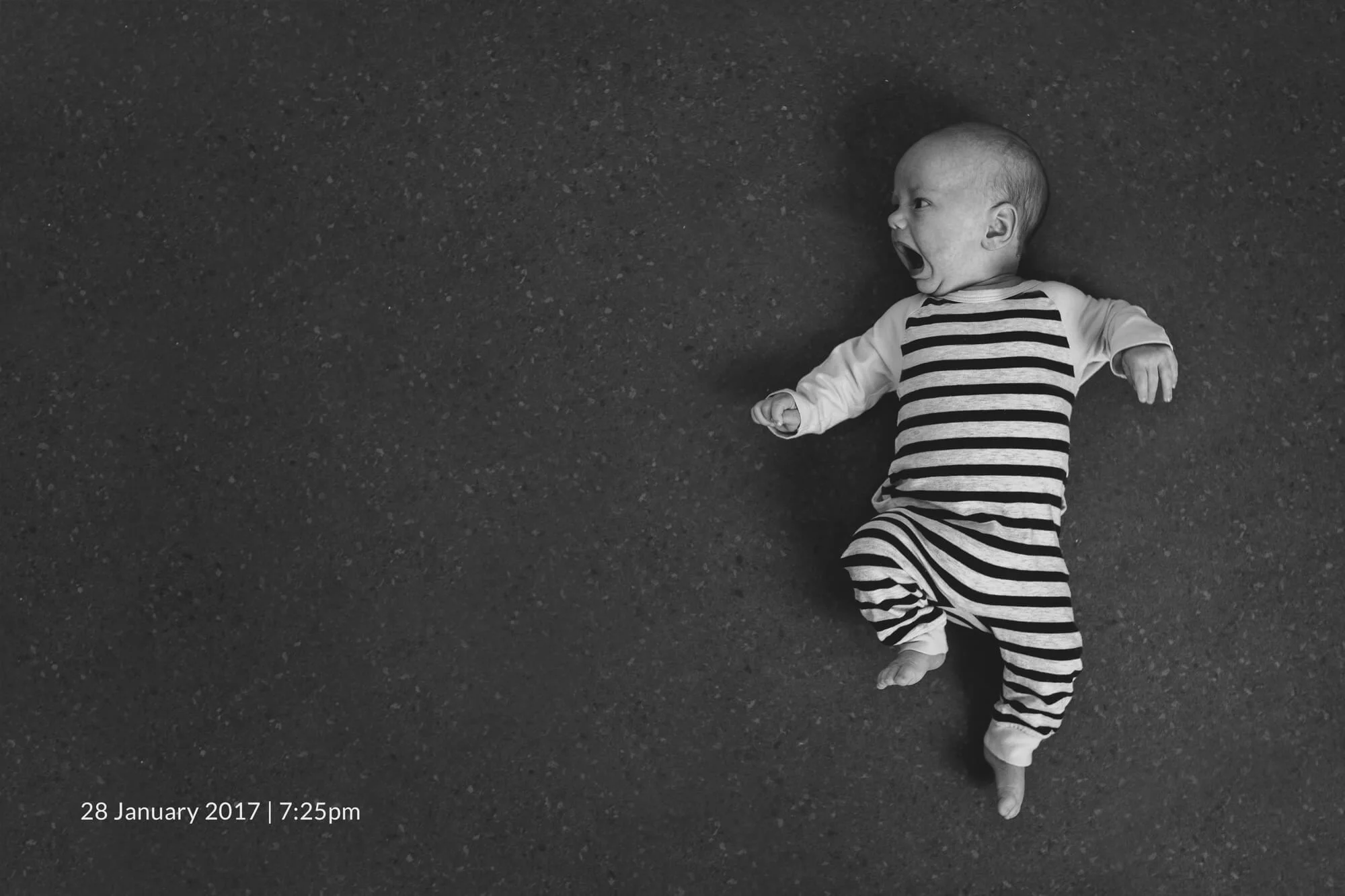Melbourne newborn lifestyle photographer. Black and white portrait of a newborn baby.
