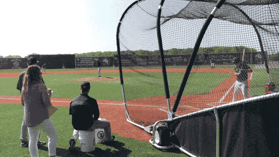 Former position player Jalen Miller strikes a batter out during a simulated game
